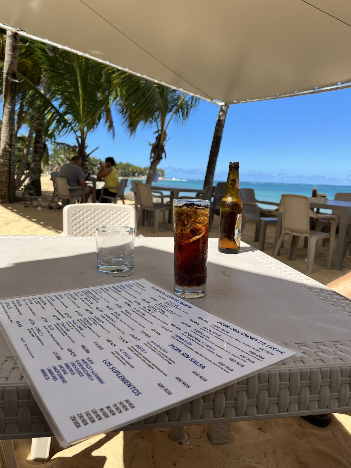 Beachside dining under palms